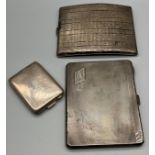 Two heavy silver cigarette cases together with a silver card holder. [328.37grams]