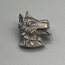 925 silver dog brooch set with a ruby stone eye. Can be used as a pendant as well.