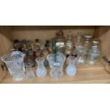 A collection of antique chemist jars , antique potion bottles, crystal vases etc