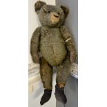 Antique large oversized mohair bear with movable limbs, glass eyes and straw filled. [105cm in