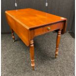 19th century mahogany drop end dining table. Fitted with two drawers and supported in turned legs