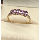 10ct yellow gold ladies ring set with purple and white topaz stones. [Ring size R] [2.04Grams]