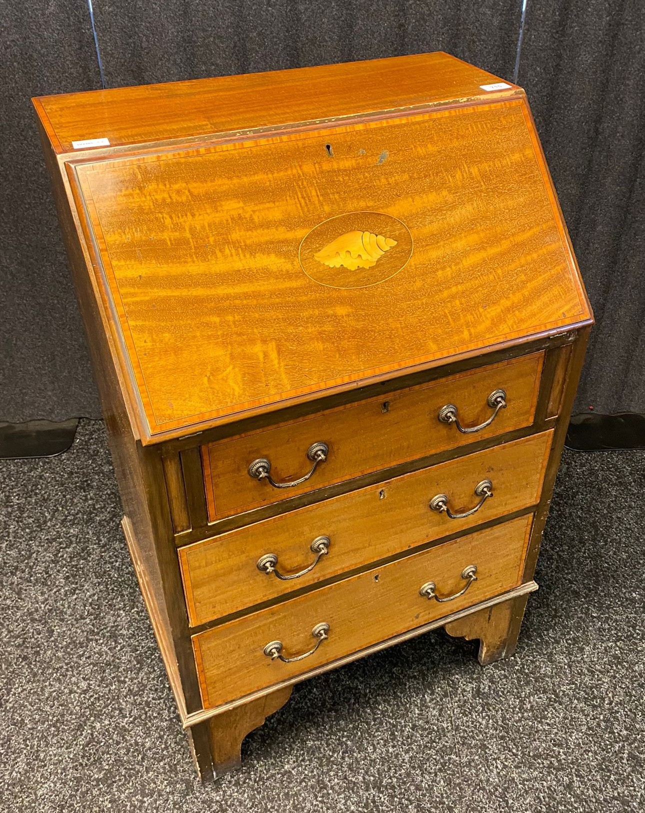 19th century bureau, the slant front with shell marquetry design, opening to an interior with fitted