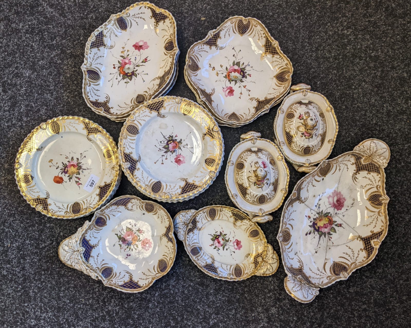 A 19th century floral design dinner service together with comport dish, two lidded serving tureens