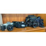 3 Vintage cameras to include cannon eos 500, Miranda & Chinon camera