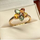 10ct yellow gold ladies ring set with various gem stones set in a flower design. [Ring size P 1/