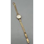 A Vintage ladies 9ct yellow gold Omega wrist watch. [Missing winder][13.85grams without workings]