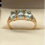 10ct yellow gold ladies ring set with aquamarine stones. [Ring size R 1/2] [2.43grams]