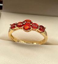 10ct yellow gold ladies ring set with 6 fire opals. [Ring size P] [2.35Grams]