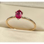 10ct yellow gold ladies ring set with a single ruby cut stone. [Ring size R] [1.26Grams]