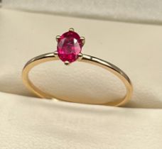 10ct yellow gold ladies ring set with a single ruby cut stone. [Ring size R] [1.26Grams]