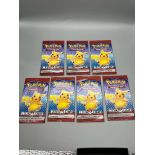 Seven sealed Pokemon trading card game cards. Match Battle.