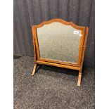 Antique adjustable mirror, the shaped frame raised on pedestal outswept legs [54x49cm]