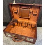 Antique/ vintage brown leather travel case has fitted compartment interior with various travelling