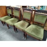 Set of 4 19th century dining room chairs with brass casters