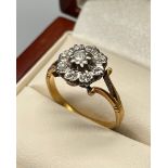 18ct yellow gold ladies ring set with single diamond centre surrounded by eight diamonds. [Ring size