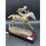 A Large Sheffield silver [filled] horse and jockey figure sat upon a wooden base. [26cm high] [
