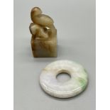 Antique Chinese jade hand carved bird sculpture together with a jade ring/ disc.