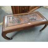 A Oriental carved coffee table