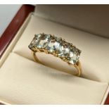 10ct yellow gold ladies ring set with 5 aquamarine stones. [Ring size P] [2.24Grams]