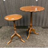 Two Antique side table, the circular top with moulded edge, raised on a pedestal, ending in three