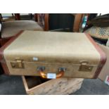 Vintage travel case with fitted interior set with amber handle