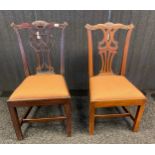Two Georgian Antique chair, the shaped back with pierced splat above a cushioned seat, raised on