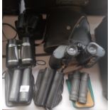 A Collection of Binoculars includes Frank Nipole 10x50s coated optics with leather case etc