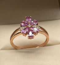10ct yellow gold ladies ring set with purple & white topaz stones, designed in a flower shape. [Ring