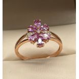 10ct yellow gold ladies ring set with purple & white topaz stones, designed in a flower shape. [Ring