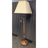 19th century free standing lamp on a turned column ending in a circular base ending in bun feet [