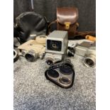 Four vintage cine cameras includes makes Bell & Howell, Sankyo, Sekonic and Maxius- CDS.