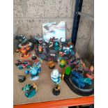A large selection of Xbox 360 Skylanders figures includes stands etc