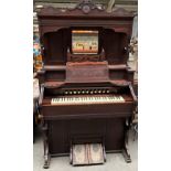 Antique bellow organ, ornate mirror and shelved cabinet.