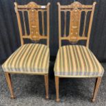 Two 19th century rosewood chairs detailed with decorative urn and floral inlays. [92.5cm high]