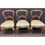 Three 19th century chairs, the shaped back with central splat, raised on cabriole legs