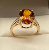 10ct yellow gold ladies ring set with a large Citrine stone. [Ring size [3.24grams]