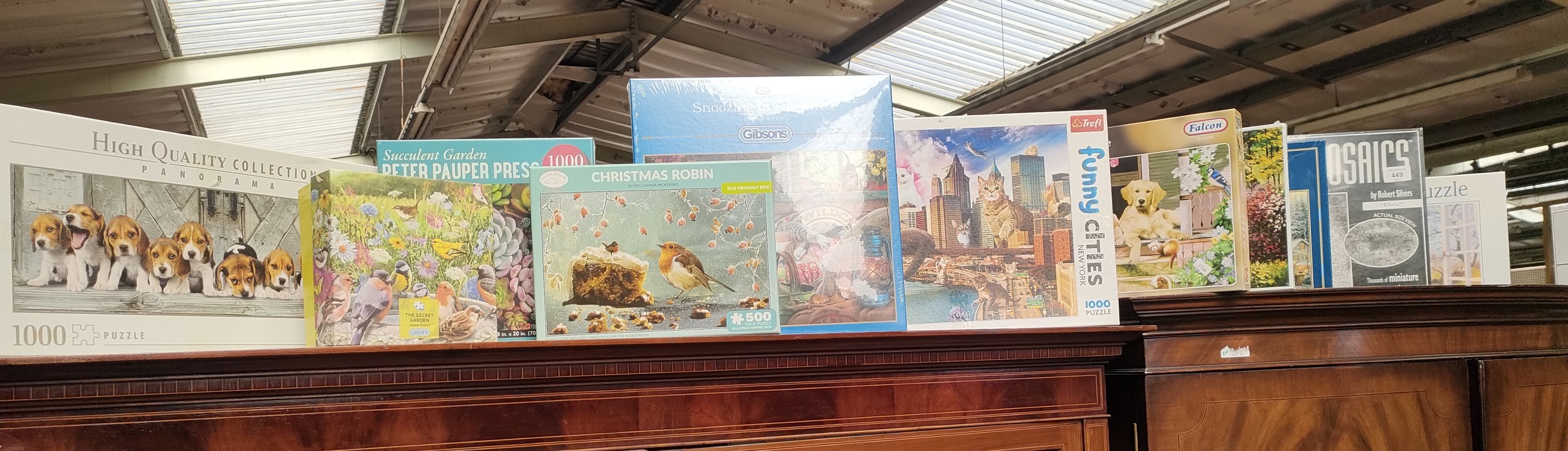 Large selection of boxed jig saw puzzles.