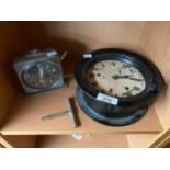Antique bulkhead style clock fitted within a bakelite body- in a working condition. Together with