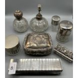 A Collection of silver marked dressing table lidded preserve pots and perfume bottles.