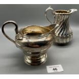 Two antique silver cream jugs. Glasgow silver and Victorian London silver makers marks. [464grams]