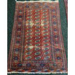 Indian red ground design rug. [183x125cm]