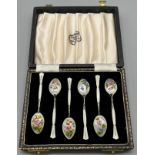 A Boxed set of 6 Birmingham silver and enamel flower design tea spoons. Produced by Henry Clifford