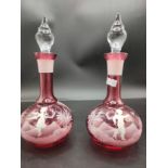 Pair of Victorian Ruby glass Mary Gregory decanters and stoppers