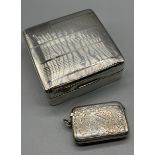 Birmingham silver cigarette box together with an ornate Birmingham silver vesta case. [Box-3.2x8.
