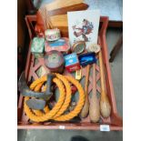 A crate of interesting items to include antique juggling sticks, Hummel tapestry, collectable tins