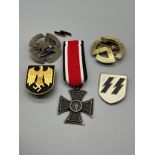 A Selection of reproduction Military German badges.