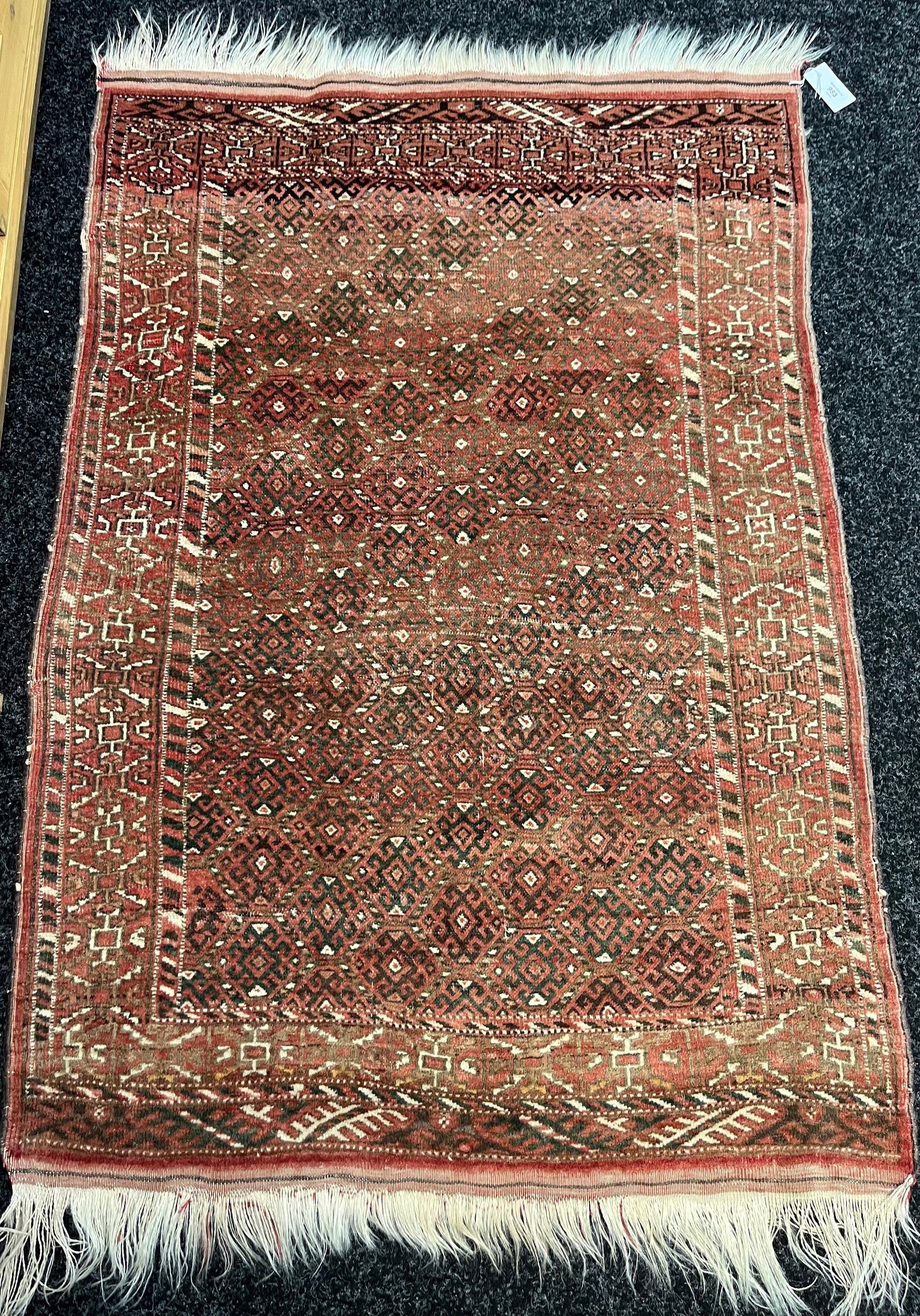 Indian hand made red ground ornate rug. [140x96cm]