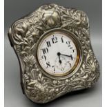 A Birmingham silver ornate pocket watch travel case. together with a large pocket watch. [13x11cm]