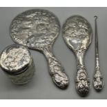 Four Silver ornate cherub design dressing table items. Two hand mirrors, button hook and lidded